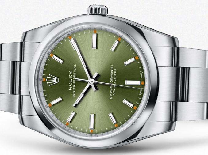 The olive dials have obvious orange luminescent dots.