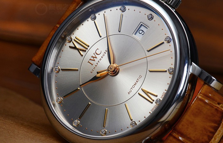 The gold hands and hour markers are striking to the silver background.